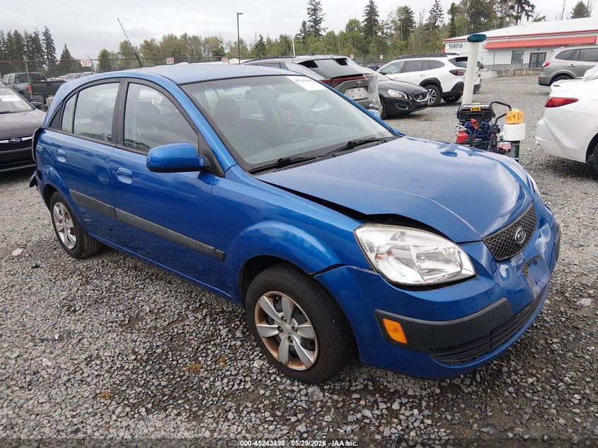 2009 Kia Rio VIN KNADE243596581215 IAAI salvage auction — FRONT & REAR, Bill Of Sale (Washington), sold $250 on 2026-07-08 (photo 1)