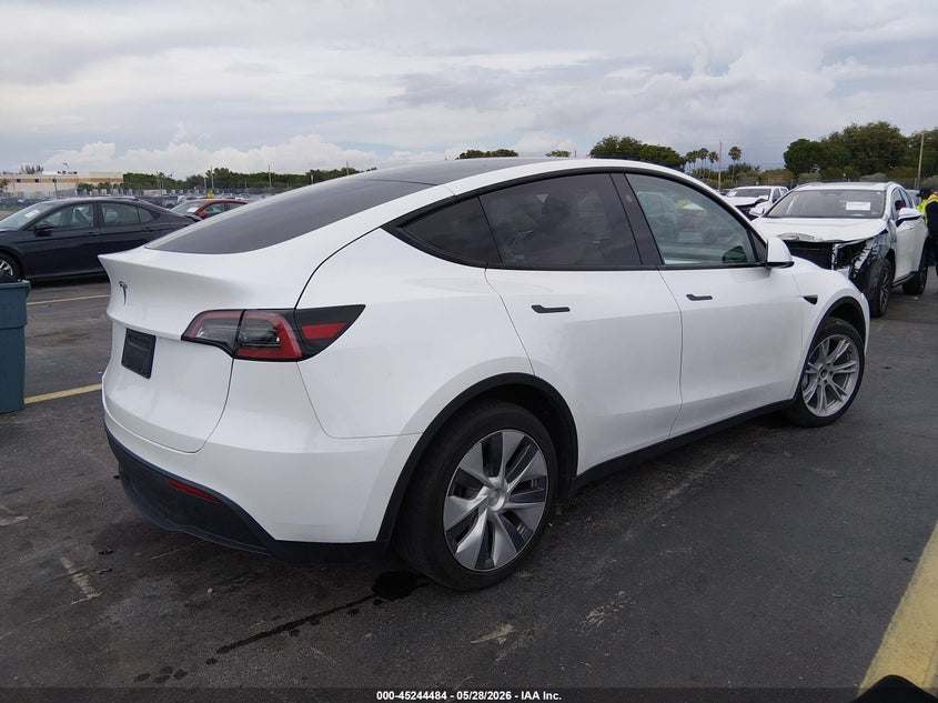 2023 Tesla Model y VIN 7SAYGDEDXPF922789 IAAI salvage auction — LEFT FRONT, Salvage Title, sold $10,100 on 2026-07-23 (photo 4)