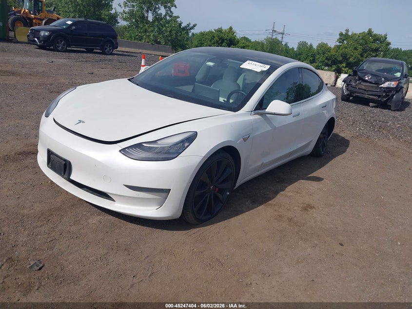 2020 Tesla Model 3 VIN 5YJ3E1EC2LF784243 IAAI salvage auction — LEFT SIDE, Salvage Title, sold $5,450 on 2026-07-09 (photo 2)
