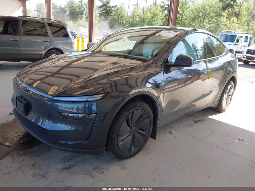 2026 Tesla Model y VIN 7SAYGDEE1TF563111 IAAI salvage auction — RIGHT SIDE, Salvage Title, sold $18,500 on 2026-07-16 (photo 2)
