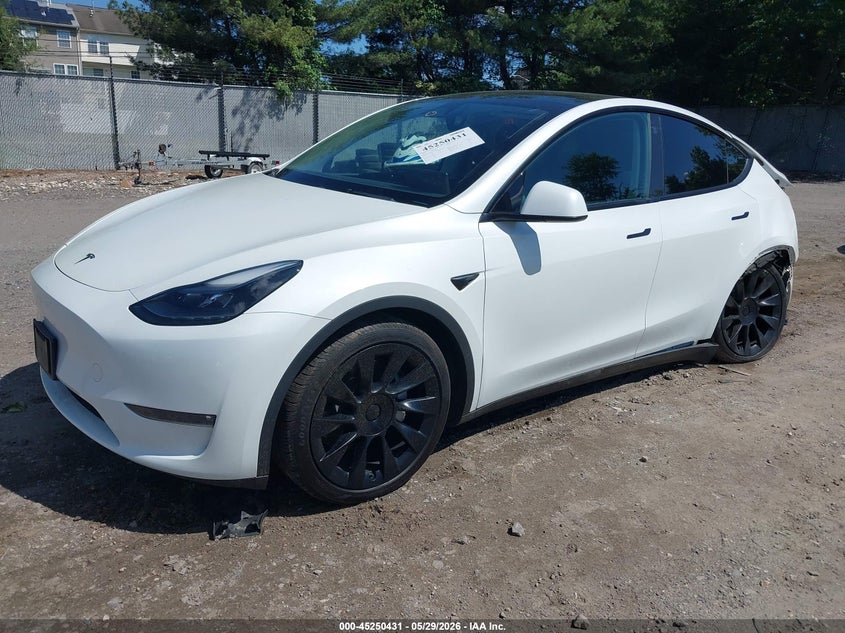 2023 Tesla Model y VIN 7SAYGDEE0PF598499 IAAI salvage auction — FRONT & REAR, Salvage Title, sold $8,100 on 2026-07-23 (photo 2)