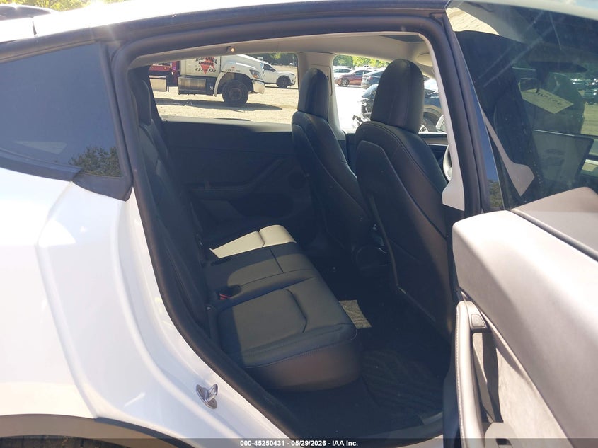 2023 Tesla Model y VIN 7SAYGDEE0PF598499 IAAI salvage auction — FRONT & REAR, Salvage Title, sold $8,100 on 2026-07-23 (photo 8)