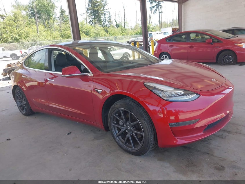 2018 Tesla Model 3 VIN 5YJ3E1EB6JF055098 IAAI salvage auction — LEFT SIDE, Salvage Title, sold $25 on 2026-07-30 (photo 1)