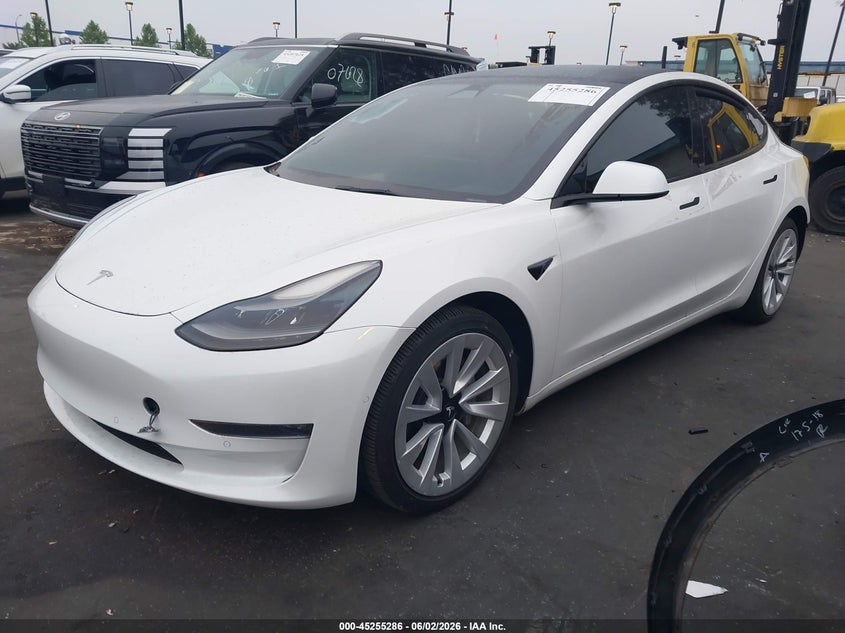 2022 Tesla Model 3 VIN 5YJ3E1EBXNF145361 IAAI salvage auction — REAR END, Salvage Title, sold $5,700 on 2026-07-12 (photo 2)