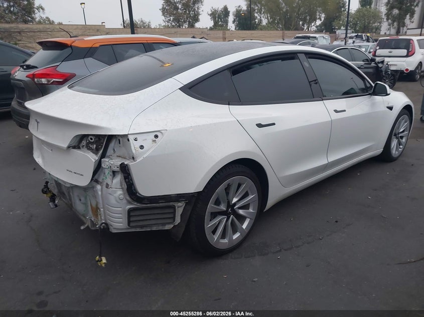 2022 Tesla Model 3 VIN 5YJ3E1EBXNF145361 IAAI salvage auction — REAR END, Salvage Title, sold $5,700 on 2026-07-12 (photo 4)