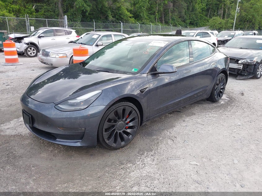 2022 Tesla Model 3 VIN 5YJ3E1EC8NF180330 IAAI salvage auction — REAR END, Salvage Title, sold $7,700 on 2026-07-09 (photo 2)