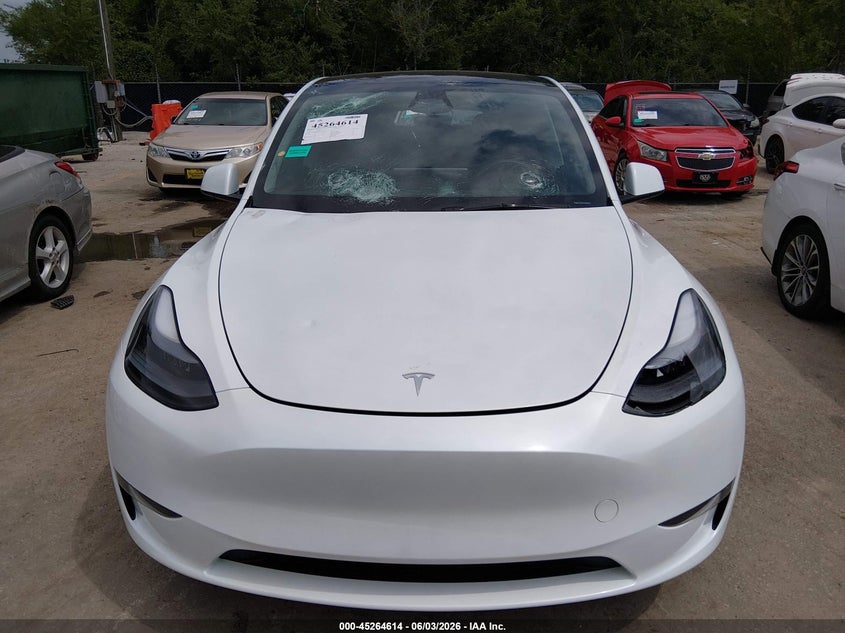 2025 Tesla Model y VIN 7SAYGDED7SA373669 IAAI salvage auction — HAIL, Salvage Title, sold $12,700 on 2026-07-30 (photo 6)