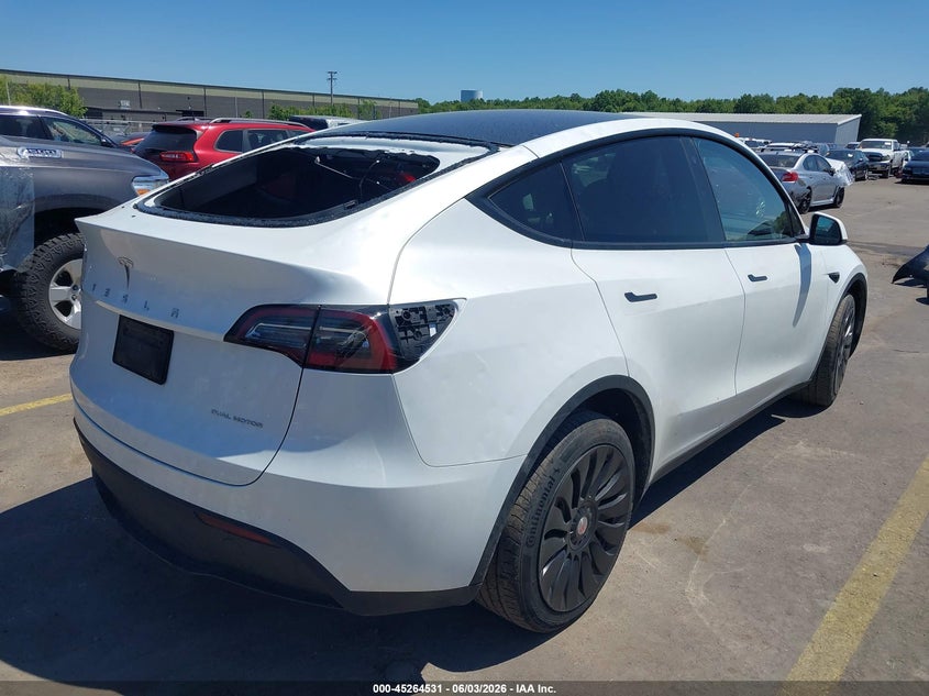 2023 Tesla Model y VIN 7SAYGDEEXPA069476 IAAI salvage auction — HAIL, Salvage Title, sold $18,200 on 2026-07-09 (photo 4)