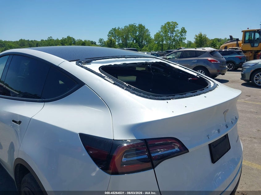 2023 Tesla Model y VIN 7SAYGDEEXPA069476 IAAI salvage auction — HAIL, Salvage Title, sold $18,200 on 2026-07-09 (photo 6)
