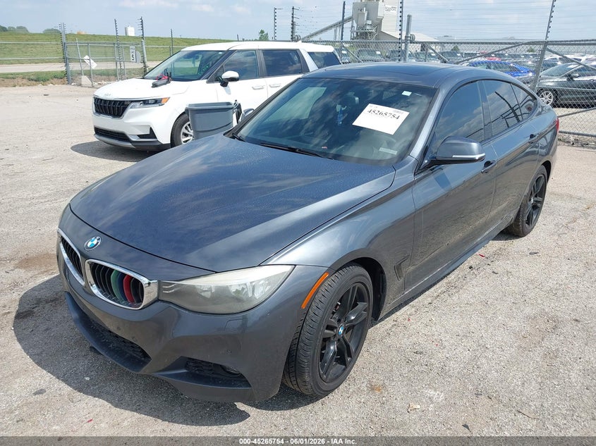 2015 BMW VIN WBA8Z5C50FD672345 IAAI salvage auction — NORMAL WEAR, Salvage Title, sold $1,025 on 2026-07-15 (photo 2)
