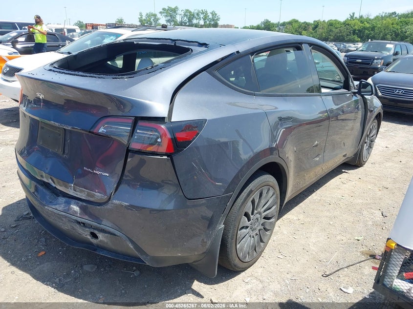 2023 Tesla Model y VIN 7SAYGDEE6PA167713 IAAI salvage auction — FRONT & REAR, Salvage Title, sold $8,600 on 2026-07-31 (photo 4)