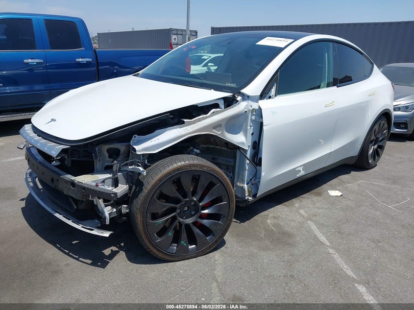 2023 Tesla Model y VIN 7SAYGDEFXPF889701 IAAI salvage auction — LEFT FRONT, Salvage Title, sold $13,100 on 2026-07-10 (photo 2)