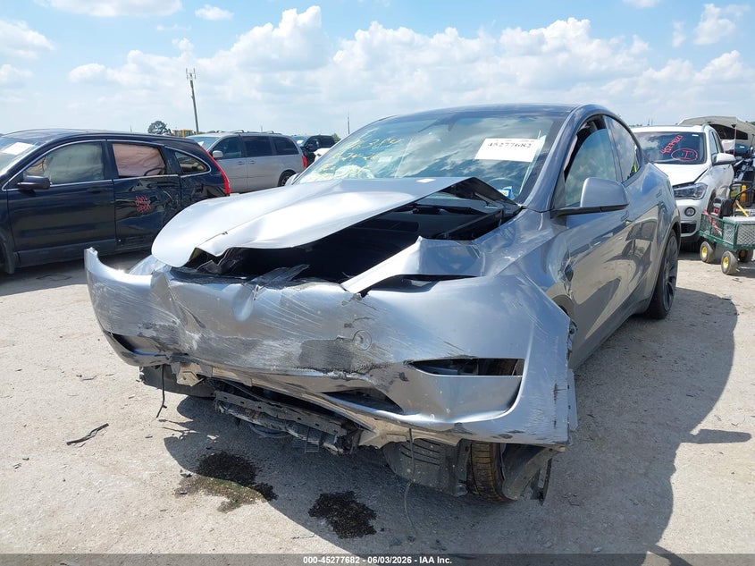 2024 Tesla Model y VIN 7SAYGDEFXRA327636 IAAI salvage auction — FRONT & REAR, Salvage Title, sold $11,975 on 2026-08-27 (photo 2)