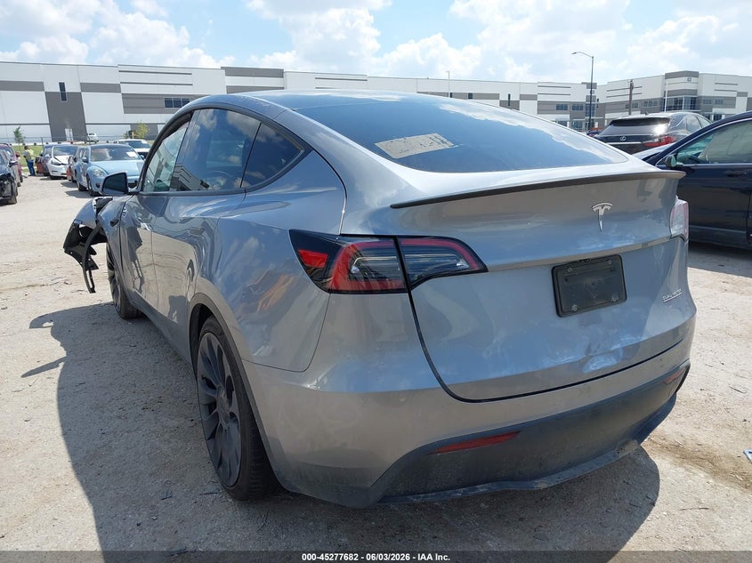 2024 Tesla Model y VIN 7SAYGDEFXRA327636 IAAI salvage auction — FRONT & REAR, Salvage Title, sold $11,975 on 2026-08-27 (photo 3)