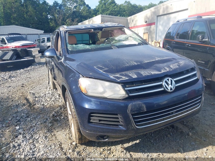 2014 Volkswagen Touareg VIN WVGEP9BP4ED010722 IAAI salvage auction — ROLLOVER, Salvage Title, sold $650 on 2026-07-28 (photo 1)