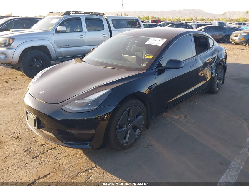 2022 Tesla Model 3 VIN 5YJ3E1EA9NF373097 IAAI salvage auction — SIDE, Salvage Title, sold $7,350 on 2026-07-14 (photo 2)