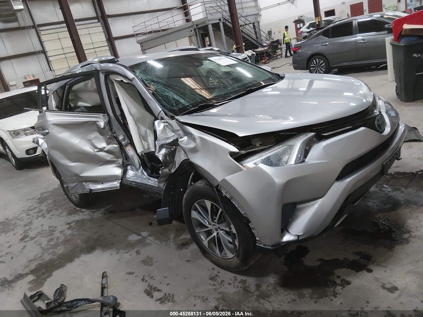 2018 Toyota Rav 4 VIN JTMRJREV0JD180961 IAAI salvage auction — SIDE, Salvage Title, sold $2,600 on 2026-07-24 (photo 1)
