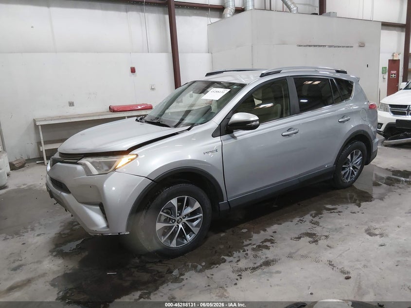 2018 Toyota Rav 4 VIN JTMRJREV0JD180961 IAAI salvage auction — SIDE, Salvage Title, sold $2,600 on 2026-07-24 (photo 2)