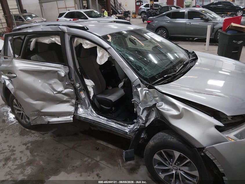 2018 Toyota Rav 4 VIN JTMRJREV0JD180961 IAAI salvage auction — SIDE, Salvage Title, sold $2,600 on 2026-07-24 (photo 6)