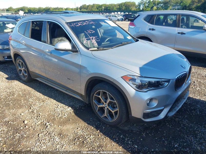2017 BMW X1 VIN WBXHT3C39H5F69483 IAAI salvage auction — LEFT SIDE, Mv-907A (New York), sold $1,750 on 2026-07-28 (photo 1)