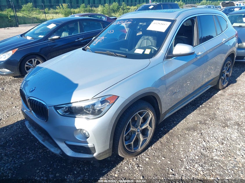 2017 BMW X1 VIN WBXHT3C39H5F69483 IAAI salvage auction — LEFT SIDE, Mv-907A (New York), sold $1,750 on 2026-07-28 (photo 2)