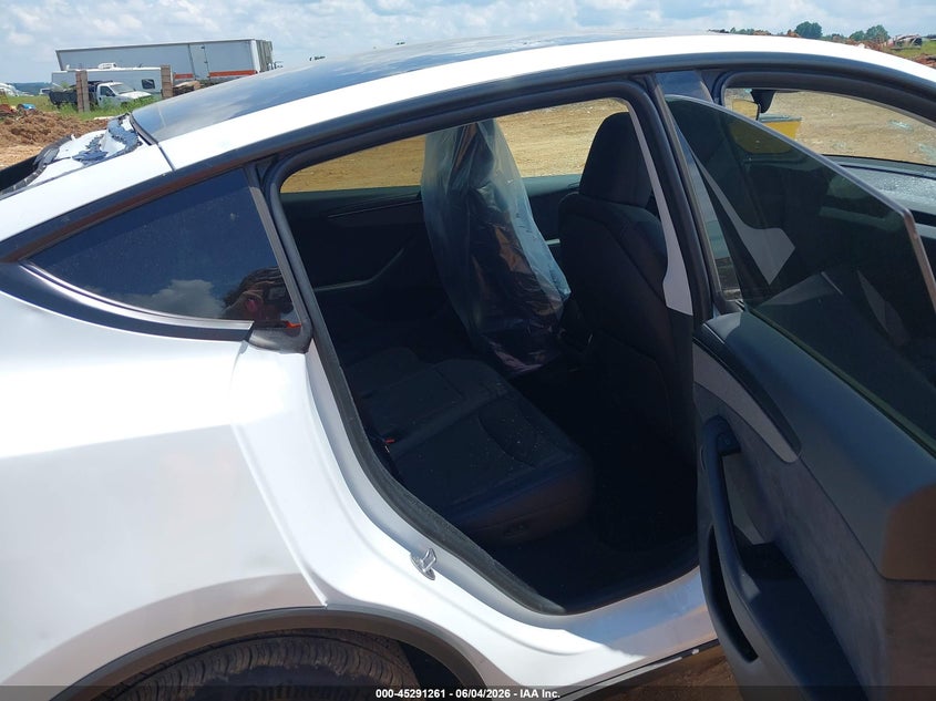 2026 Tesla Model y VIN 7SAYGDED9TF423234 IAAI salvage auction — HAIL, Salvage Title, sold $22,950 on 2026-07-16 (photo 8)