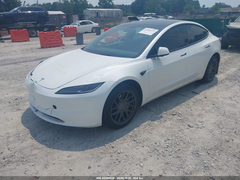 2025 Tesla Model 3 VIN 5YJ3E1EA6SF890000 IAAI salvage auction — SIDE, Salvage Title, sold $13,575 on 2026-07-21 (photo 2)