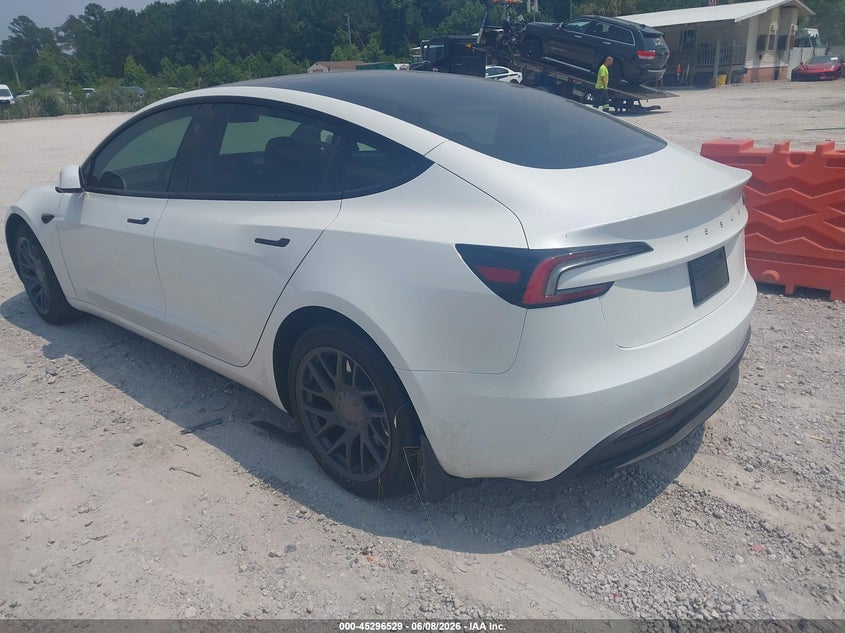2025 Tesla Model 3 VIN 5YJ3E1EA6SF890000 IAAI salvage auction — SIDE, Salvage Title, sold $13,575 on 2026-07-21 (photo 3)