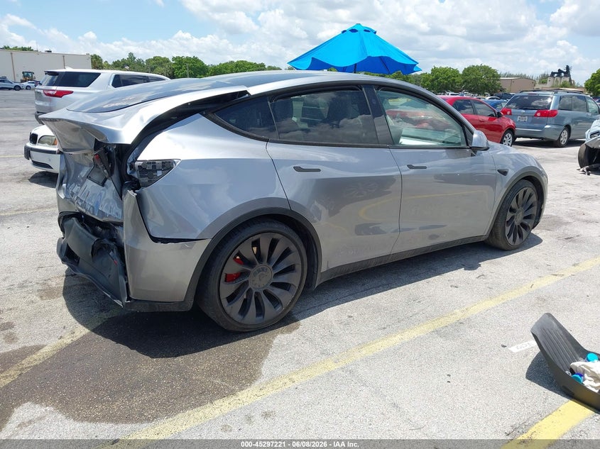 2024 Tesla Model y VIN 7SAYGDEF0RA306441 IAAI salvage auction — REAR END, Salvage Title, sold $12,875 on 2026-07-09 (photo 4)