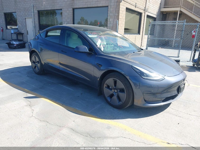 2022 Tesla Model 3 VIN 5YJ3E1EAXNF125599 IAAI salvage auction — REAR END, Salvage Title, sold $7,400 on 2026-07-13 (photo 1)