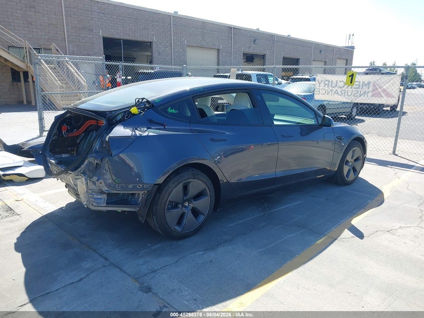 2022 Tesla Model 3 VIN 5YJ3E1EAXNF125599 IAAI salvage auction — REAR END, Salvage Title, sold $7,400 on 2026-07-13 (photo 4)
