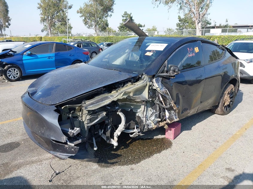 2024 Tesla Model y VIN 7SAYGDEE1RA233359 IAAI salvage auction — ROLLOVER, Salvage Title, sold $1,750 on 2026-07-21 (photo 2)