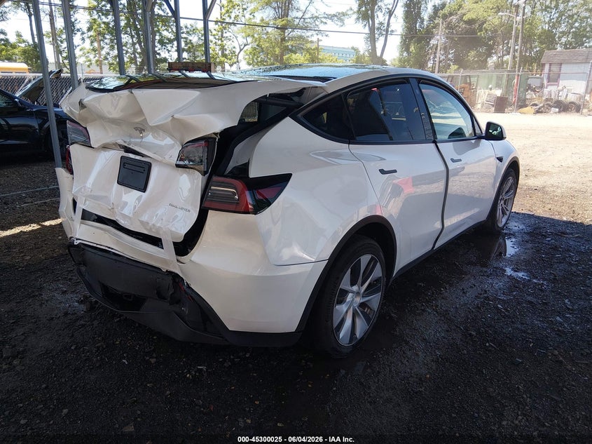 2023 Tesla Model y VIN 7SAYGDEE9PF632780 IAAI salvage auction — REAR END, Salvage Title, sold $11,025 on 2026-07-06 (photo 4)