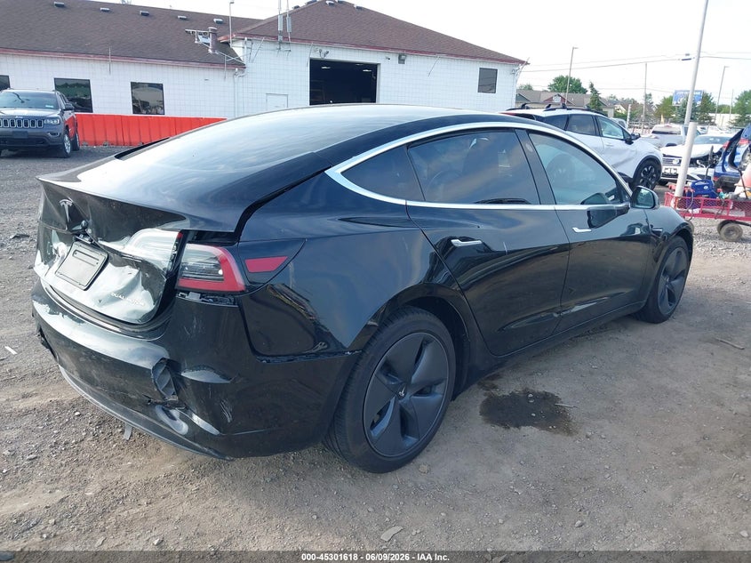 2020 Tesla Model 3 VIN 5YJ3E1EB2LF599777 IAAI salvage auction — REAR END, Salvage Title, sold $3,750 on 2026-07-30 (photo 4)