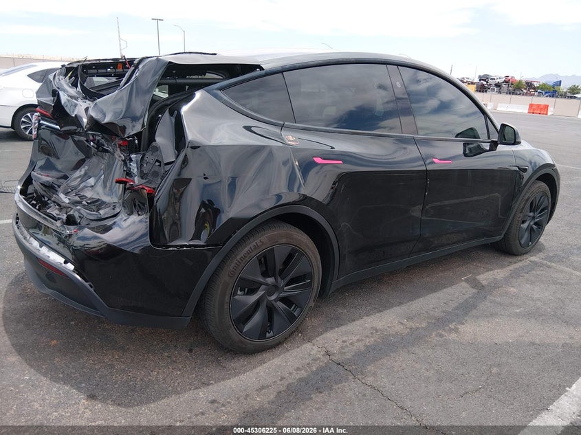 2025 Tesla Model y VIN 7SAYGDED9SF313878 IAAI salvage auction — REAR END, Salvage (Nevada), sold $10,900 on 2026-07-30 (photo 4)