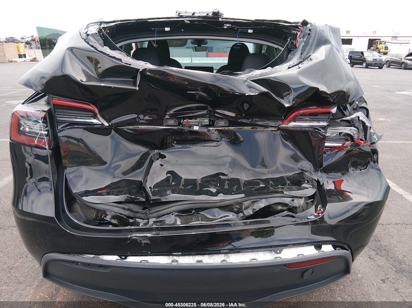 2025 Tesla Model y VIN 7SAYGDED9SF313878 IAAI salvage auction — REAR END, Salvage (Nevada), sold $10,900 on 2026-07-30 (photo 6)
