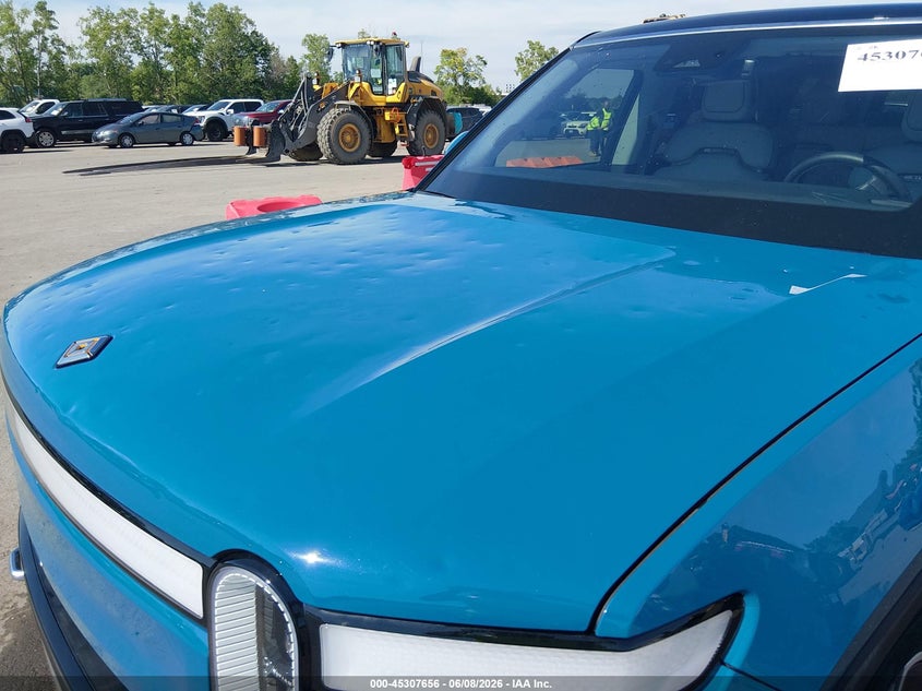2023 Rivian R1s VIN 7PDSGABA3PN014299 IAAI salvage auction — HAIL, Salvage Title, sold $30,750 on 2026-07-07 (photo 6)