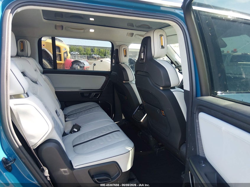 2023 Rivian R1s VIN 7PDSGABA3PN014299 IAAI salvage auction — HAIL, Salvage Title, sold $30,750 on 2026-07-07 (photo 8)