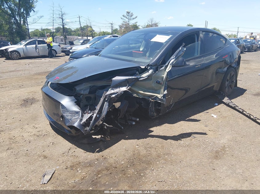 2024 Tesla Model y VIN 7SAYGDED5RF186542 IAAI salvage auction — SIDE, Salvage (Idaho), sold $7,300 on 2026-07-29 (photo 2)