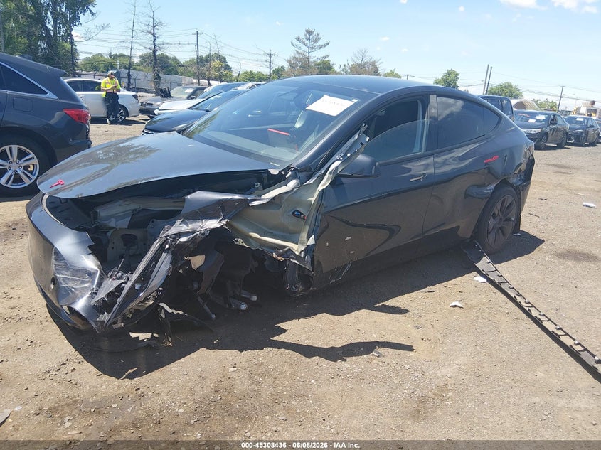 2024 Tesla Model y VIN 7SAYGDED5RF186542 IAAI salvage auction — SIDE, Salvage (Idaho), sold $7,300 on 2026-07-29 (photo 6)