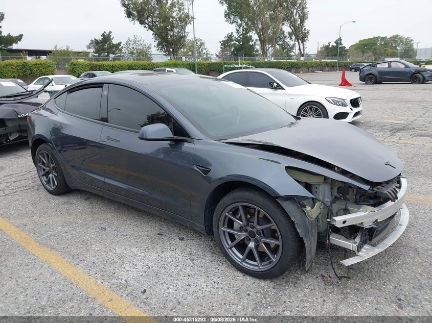 2023 Tesla Model 3 VIN 5YJ3E1EAXPF409754 IAAI salvage auction — FRONT & REAR, Salvage Title, sold $7,700 on 2026-07-07 (photo 1)