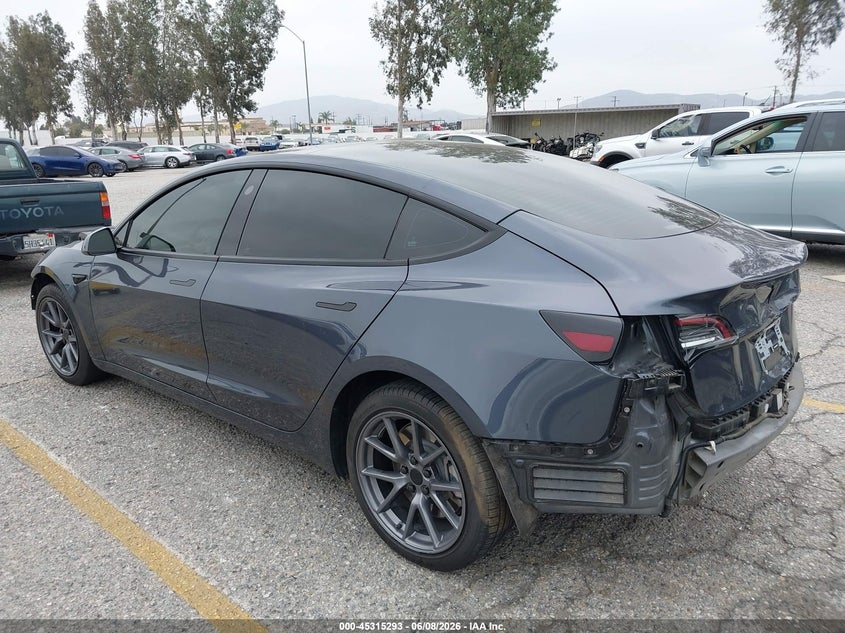 2023 Tesla Model 3 VIN 5YJ3E1EAXPF409754 IAAI salvage auction — FRONT & REAR, Salvage Title, sold $7,700 on 2026-07-07 (photo 3)