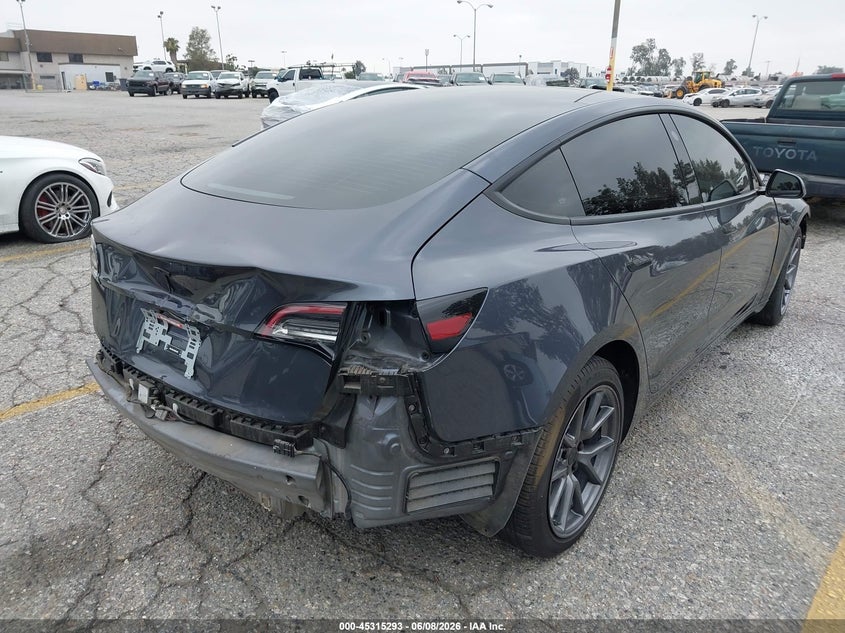 2023 Tesla Model 3 VIN 5YJ3E1EAXPF409754 IAAI salvage auction — FRONT & REAR, Salvage Title, sold $7,700 on 2026-07-07 (photo 4)