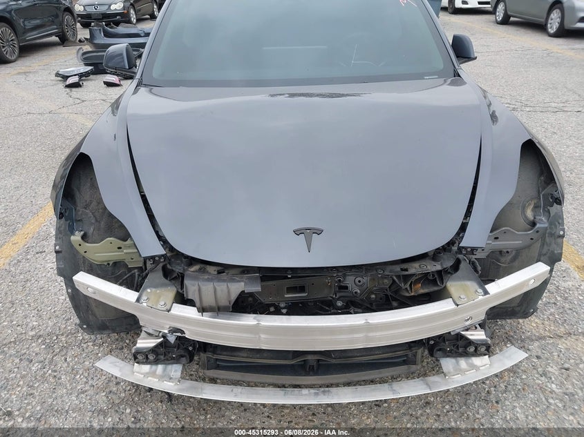 2023 Tesla Model 3 VIN 5YJ3E1EAXPF409754 IAAI salvage auction — FRONT & REAR, Salvage Title, sold $7,700 on 2026-07-07 (photo 6)