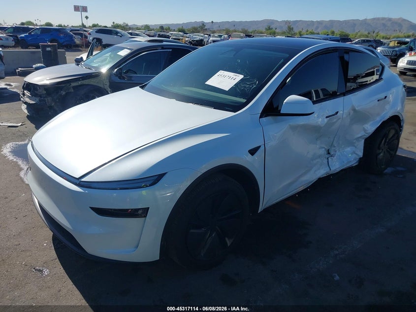 2026 Tesla Model y VIN 7SAYGDED2TA475611 IAAI salvage auction — SIDE, Salvage Title, sold $16,000 on 2026-07-15 (photo 2)