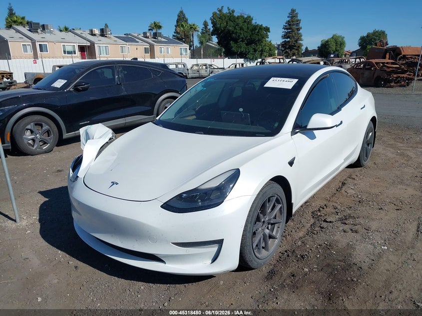 2021 Tesla Model 3 VIN 5YJ3E1EB4MF009208 IAAI salvage auction — SIDE, Salvage Title, sold $5,100 on 2026-07-28 (photo 2)