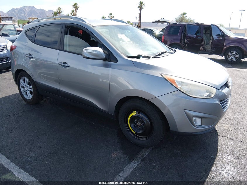 2013 Hyundai Tucson VIN KM8JU3AC7DU550602 IAAI salvage auction — SIDE, Salvage Title, sold $1,550 on 2026-07-25 (photo 1)