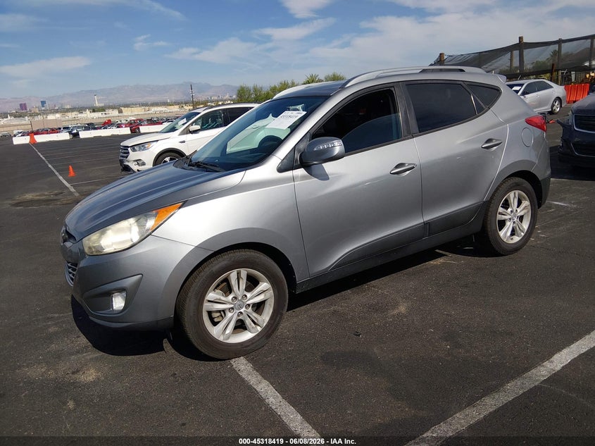 2013 Hyundai Tucson VIN KM8JU3AC7DU550602 IAAI salvage auction — SIDE, Salvage Title, sold $1,550 on 2026-07-25 (photo 2)