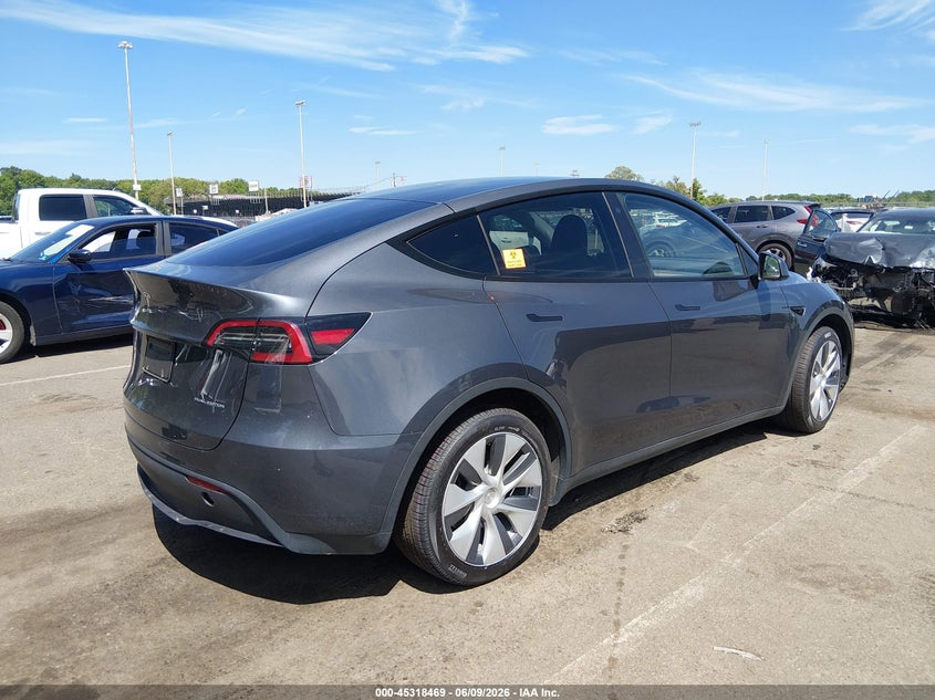 2023 Tesla Model y VIN 7SAYGDEE5PA040693 IAAI salvage auction — BIO HAZARD, Salvage Title, sold $18,800 on 2026-07-13 (photo 4)