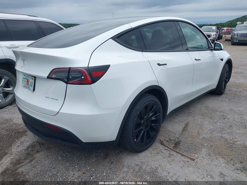 2023 Tesla Model y VIN 7SAYGDEE5PF607665 IAAI salvage auction — LEFT REAR, Salvage (Florida), sold $12,900 on 2026-07-08 (photo 4)